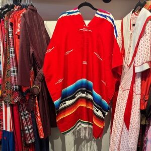 Vibrant Aztec Red Poncho with Multicolor Stripes & Fringe
